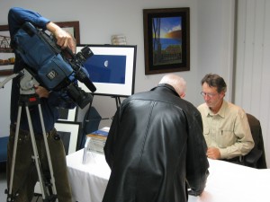 Local TV cameraman covers the event