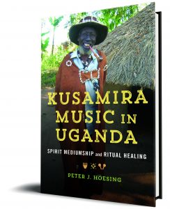 This book cover shows a contemporary Ugandan traditional medicine practitioner smiling at the camera.