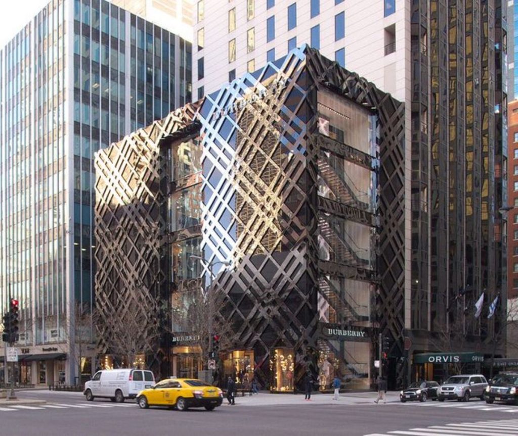 Gold and brown building materials form a plaid pattern on the outside of Burberry's flagship shop in Chicago.