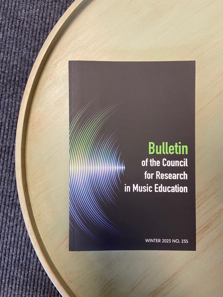 Cover of the Bulletin for the Council for Research in Music Education, Volume 235, Winter 2023.
Black background with white text and white illustration resembling part of a vinyl record.