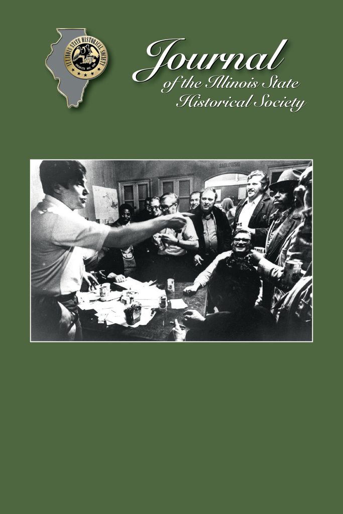 Cover of the Journal of the Illinois State Historical Society, Volume 117, Issue 3, Fall 2024.Black and white photograph of a group of men around a table, set on a green background.