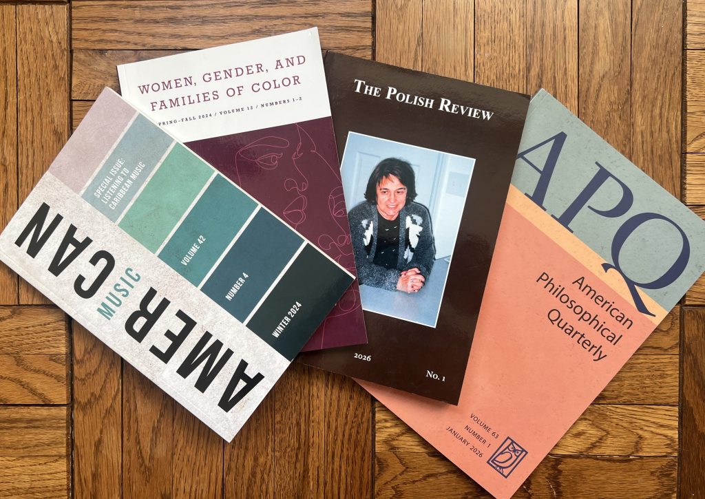 Four journals laid out next to each other: (from left to right) American Music Vol. 42, Iss. 2; Women, Gender, and Families of Color Vol. 12, Iss. 1-2; The Polish Review Vol. 71, Iss. 1; American Philosophical Quarterly Vol. 63, Iss. 1