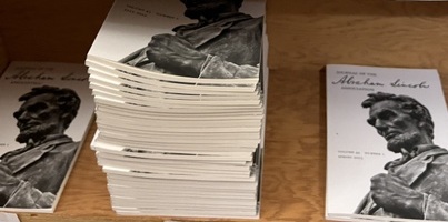 Shelf of copies of the Journal of the Abraham Lincoln Association in a large stack.