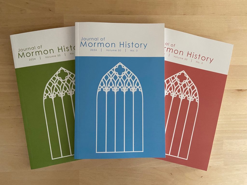 Journal of Mormon History issues stacked on top of each other.