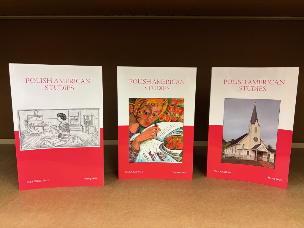 Three issues of Polish American Studies standing in a row on a tabletop.