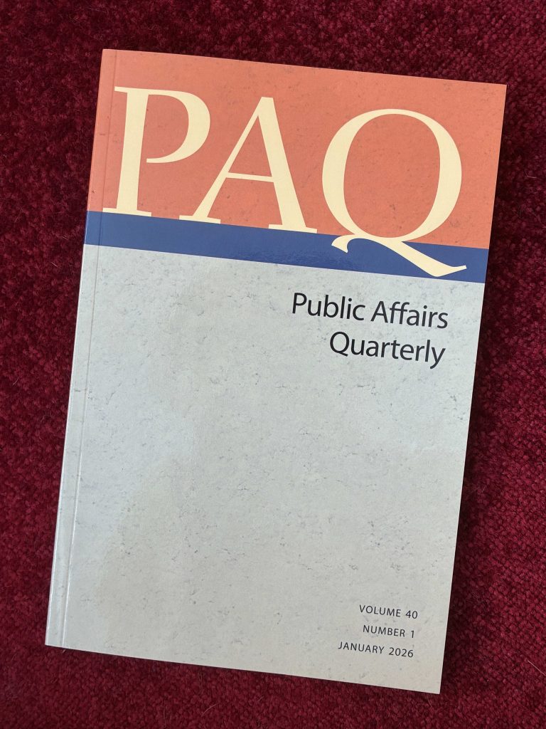 Cover of Public Affairs Quarterly, Volume 40, Issue 1, January 2026
Yellow letters spell "PAQ" at the top of the page on an orange rectangle, with a thin blue rectangle below separating it from the rest of the beige background.